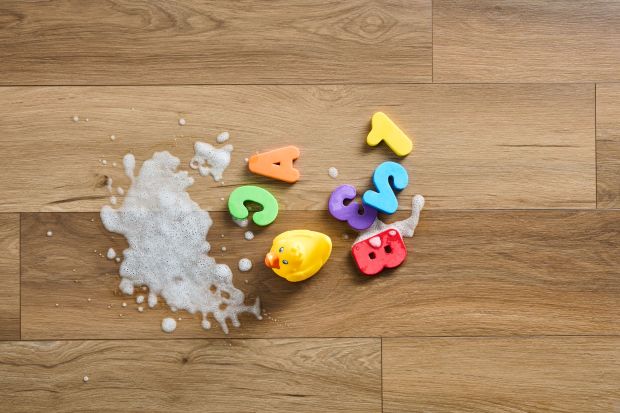Hybrid resilient floor with alphabet letters, duck, and spilled milk; waterproof flooring option; Ingenious Plank from Robbins