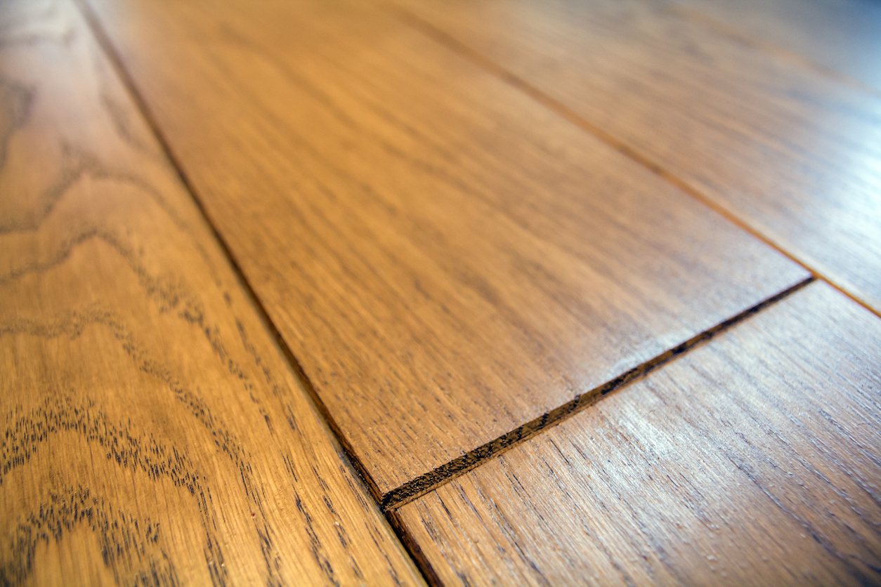 Closeup showing the beveled edges of prefinished hardwood flooring