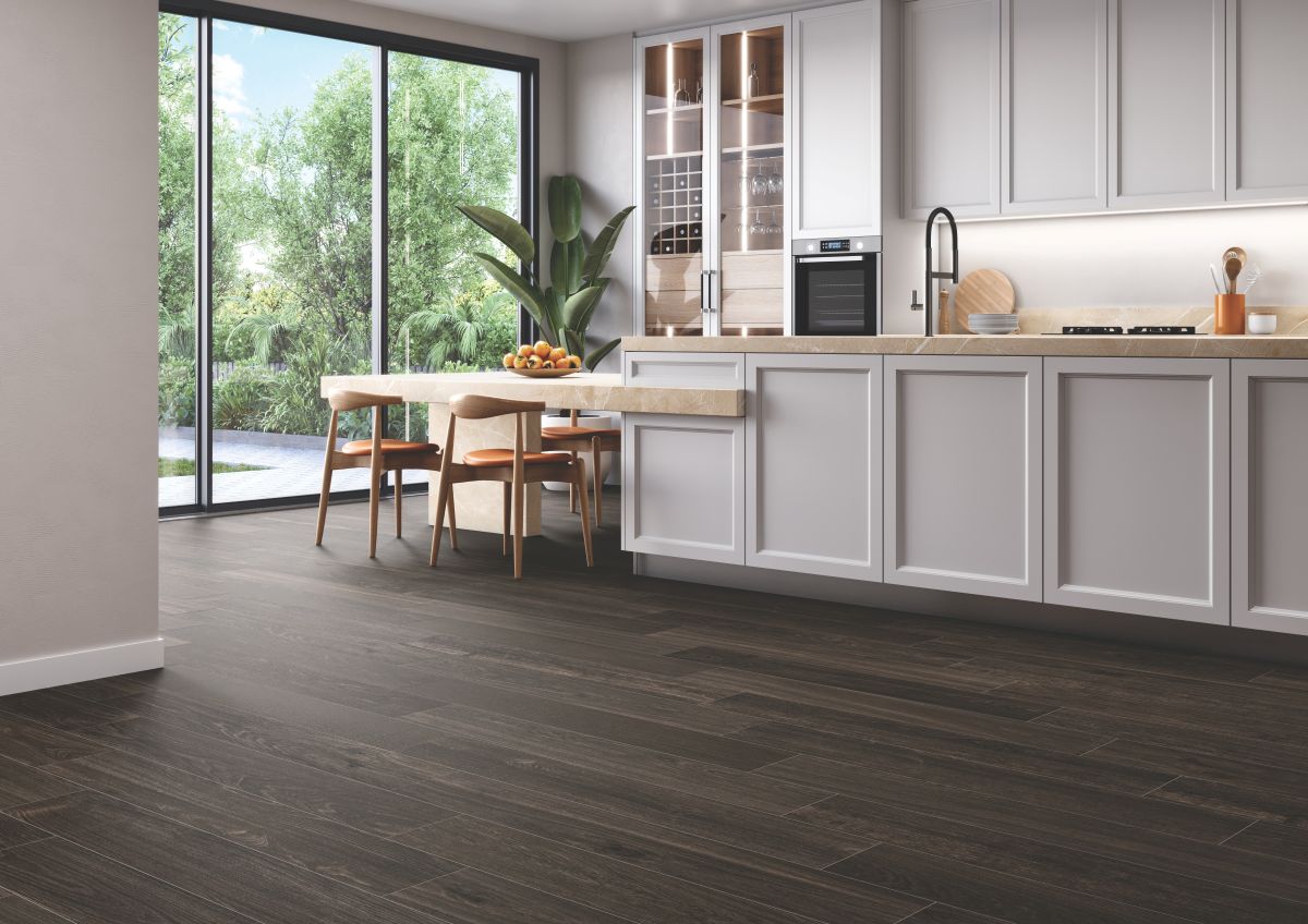 Kitchen with an island an porcelain woodgrain tile flooring