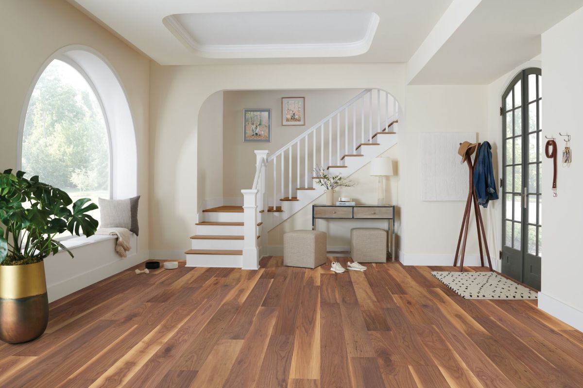 Foyer area with staircase featuring walnut engineered hardwood flooring