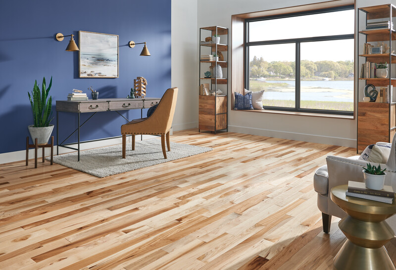 Office area with a large window and hickory flooring