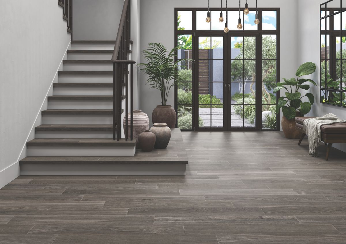 Entryway with a staircase to the side and wood-look porcelain stone tile