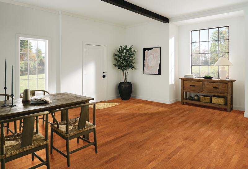 Image of a dining room focusing on its hardwood floors