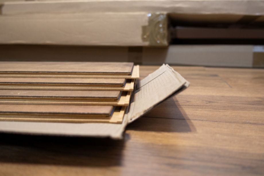 Open carton of wood flooring to acclimate the flooring before installation